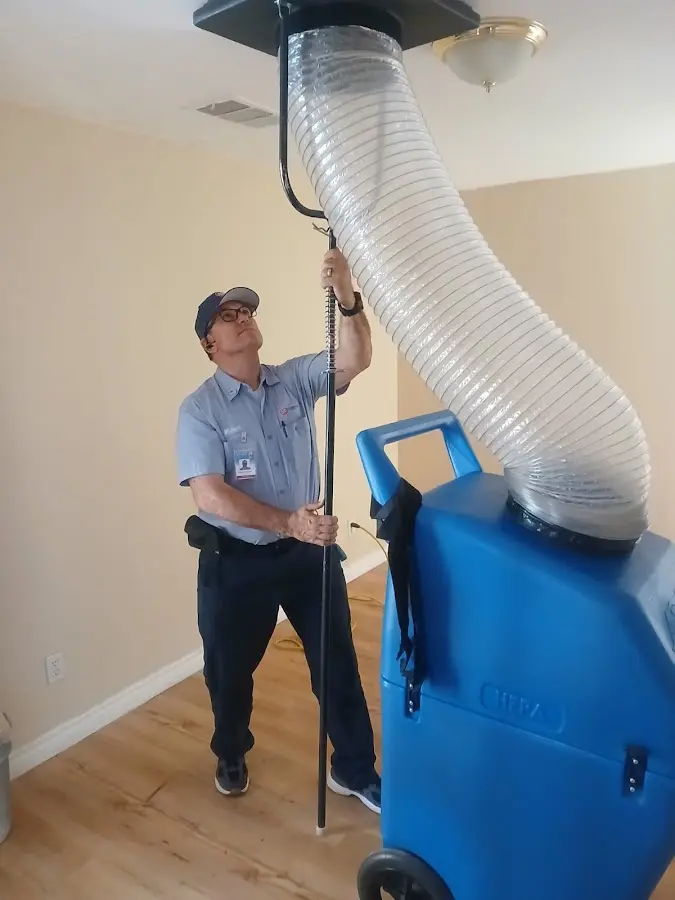 Furnace Tune-Up technician using HEPA equipment in Myrtle Grove